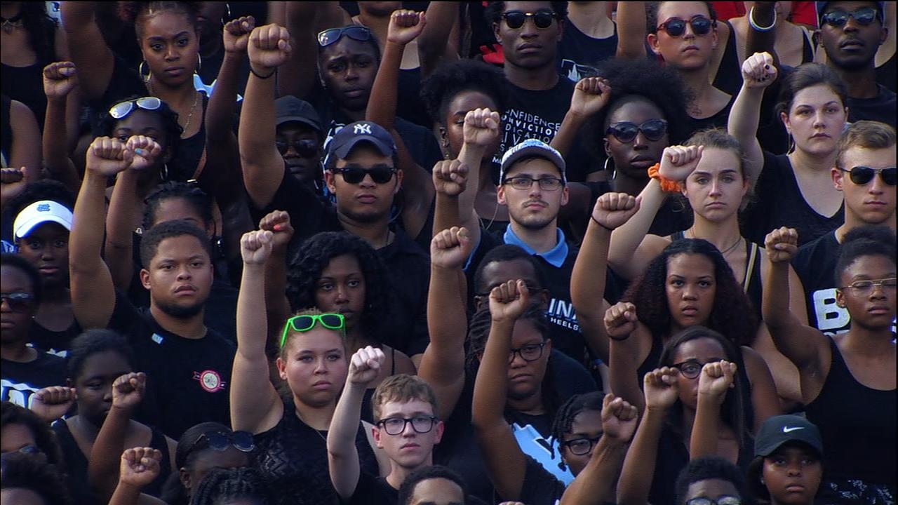 UNC fans, band protest during national anthem
