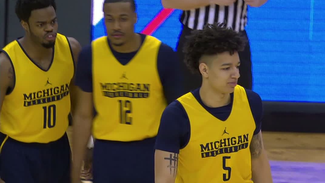 Michigan forced to take court in practice uniforms