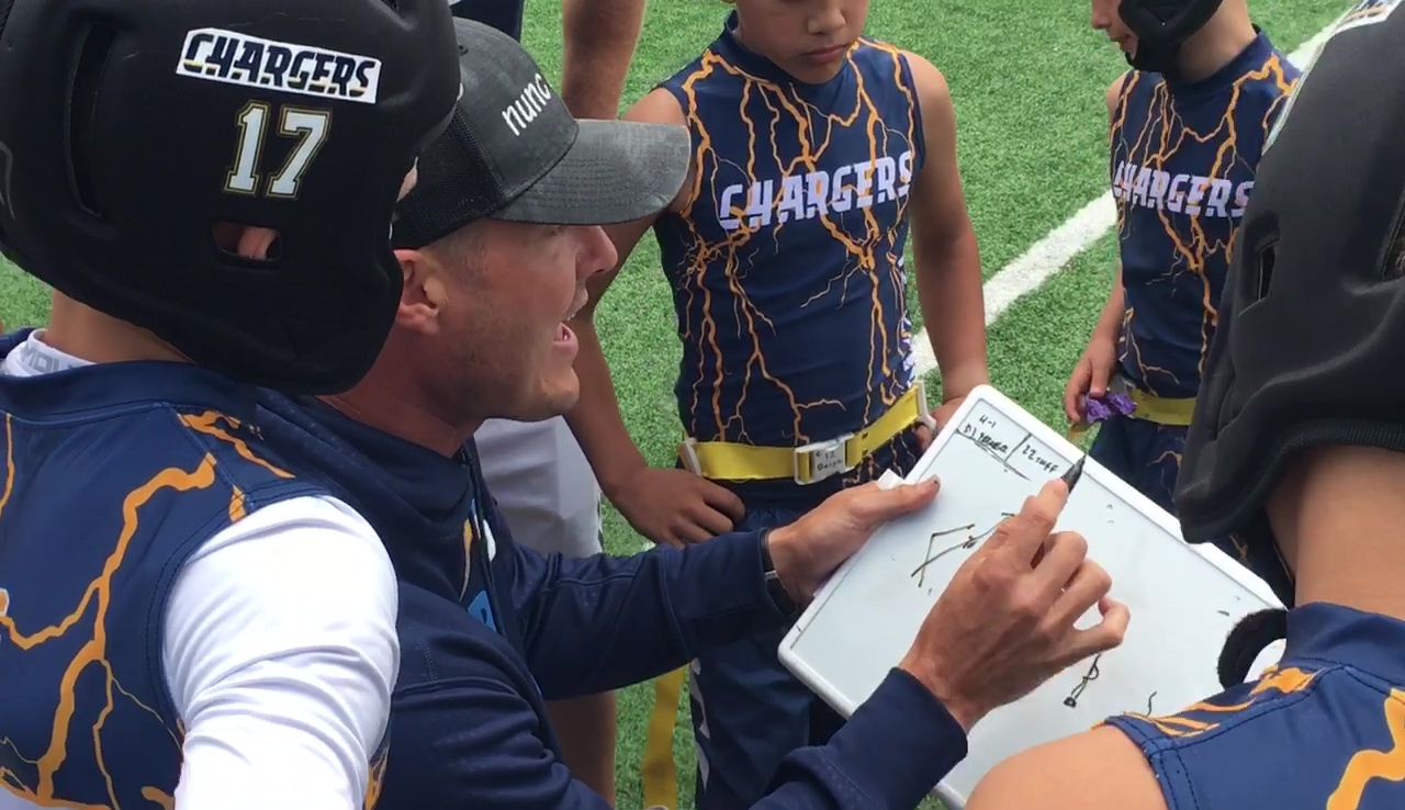 Rivers' passion for coaching on display with son's football team