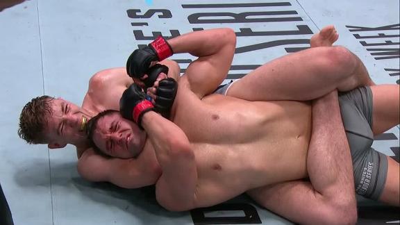 Kyle Daukaus working for a submission in the Octagon