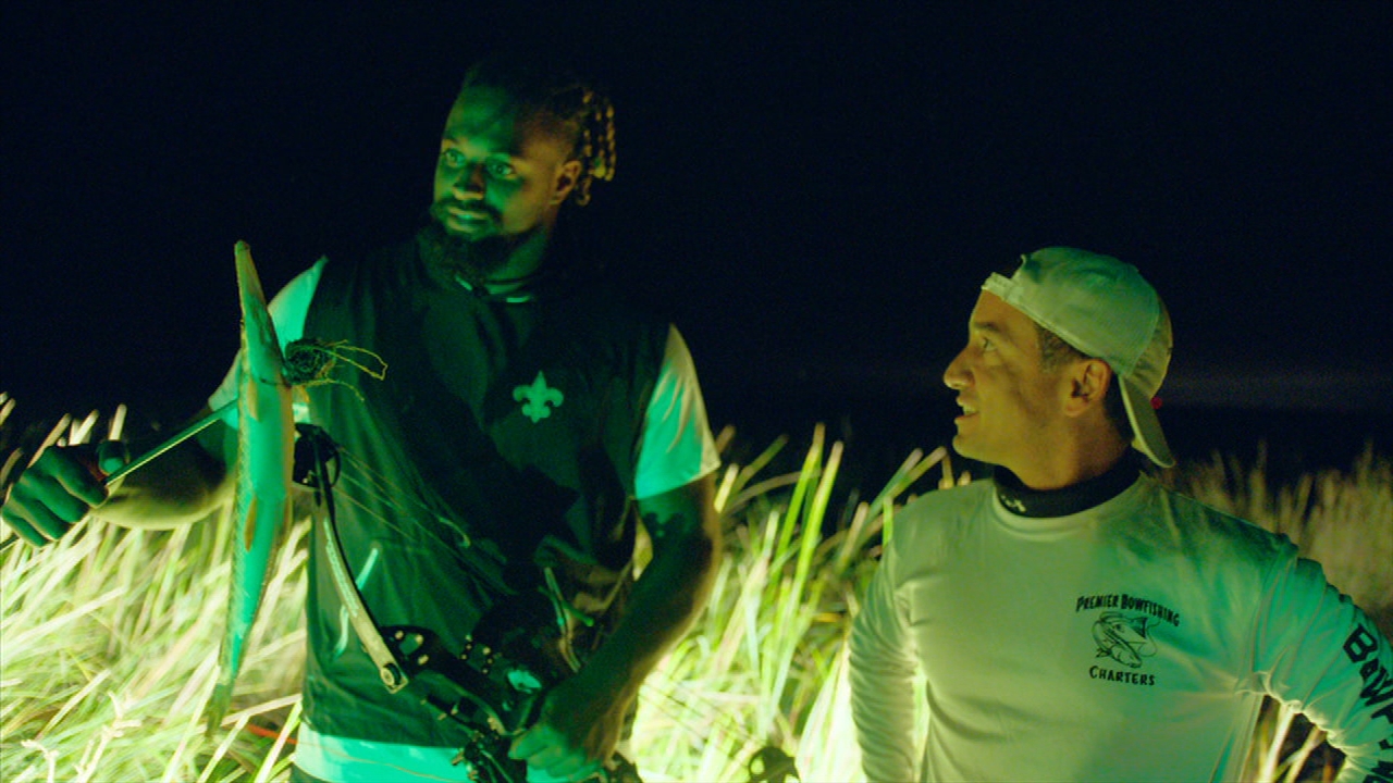 Cam Jordan gives a lesson in bowfishing
