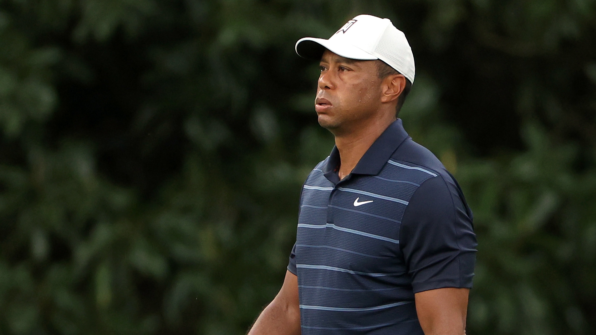 Tiger settles for par after near ace