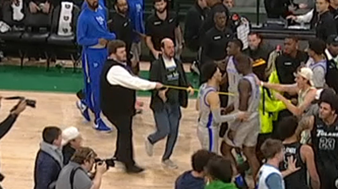 Tulane fan makes contact with Memphis player during court storm