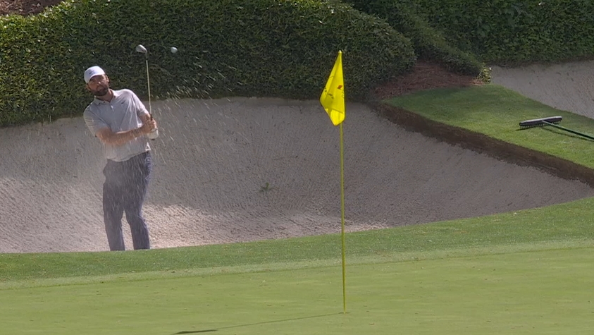Scheffler chips in for birdie from the bunker