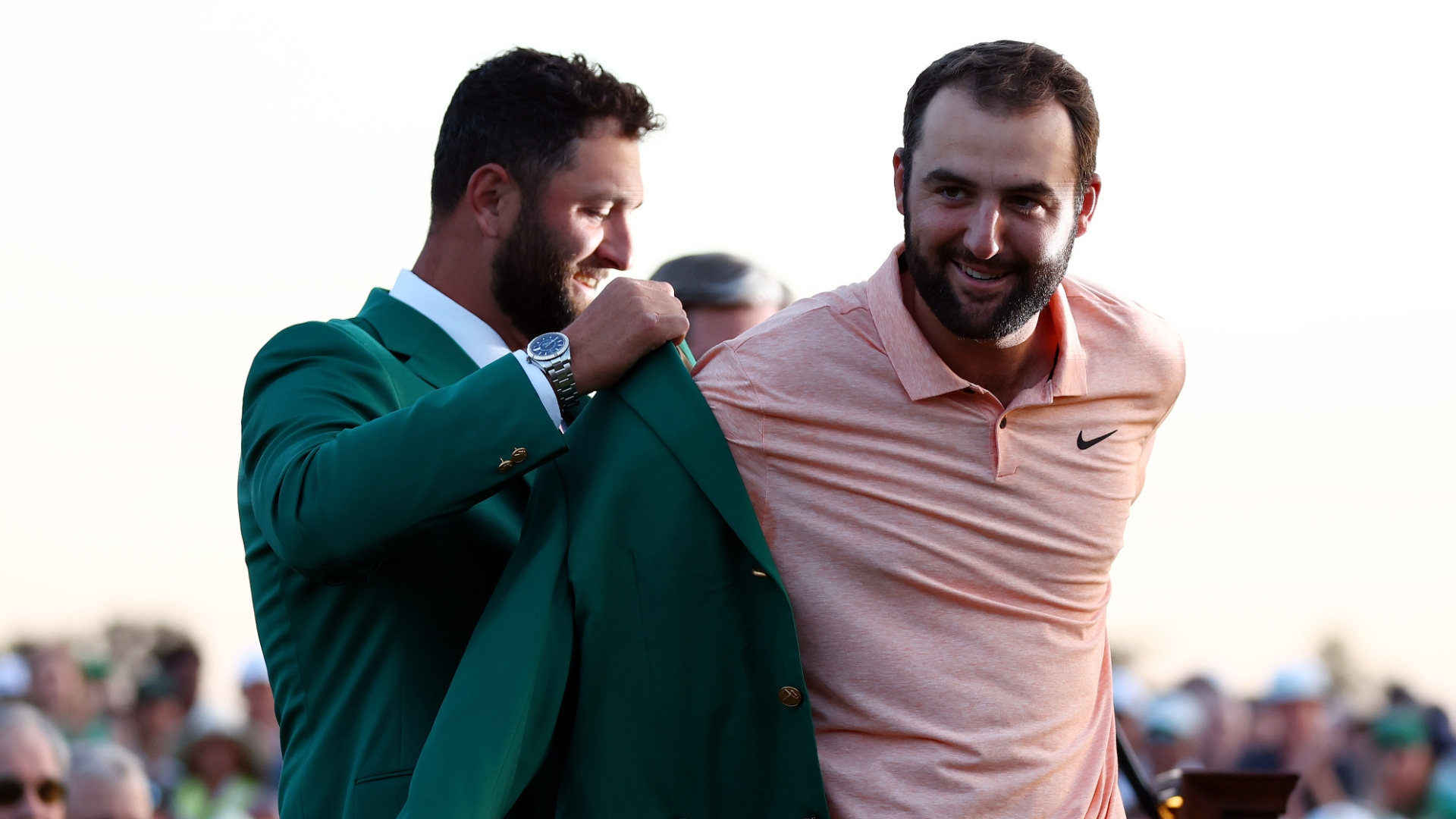 Scottie Scheffler receives green jacket from Jon Rahm after Masters win