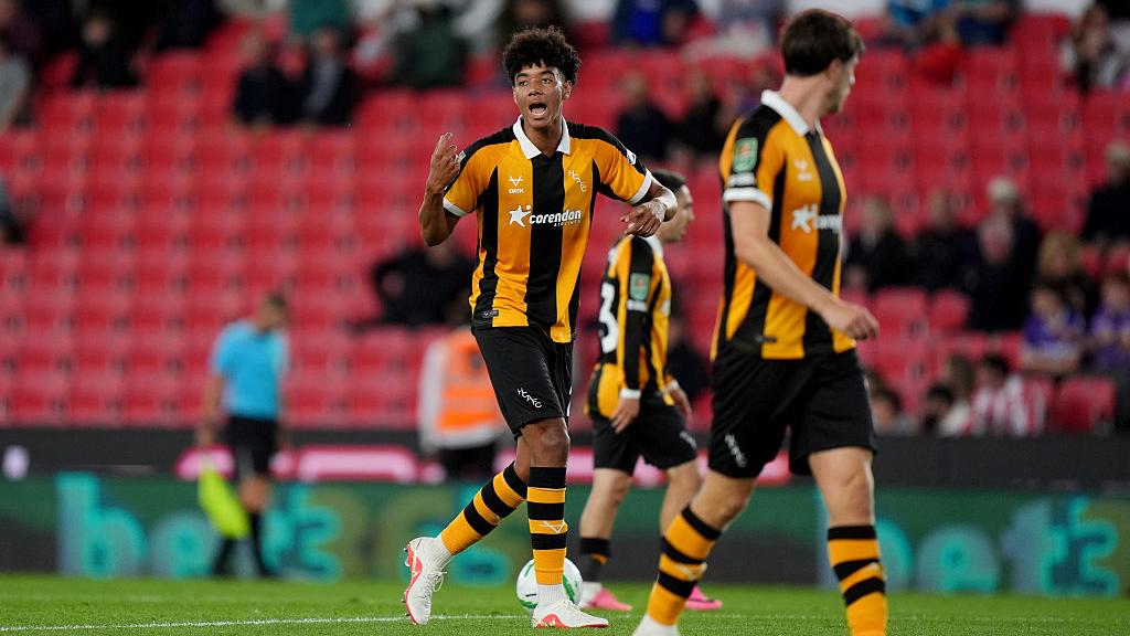 Hull win on penalties in Herrington's first start