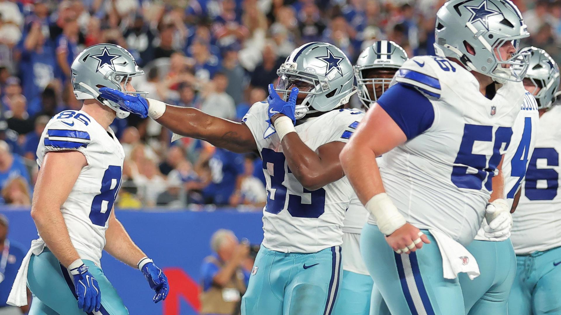 Giants' offense rolls over the Cowboys to give coach John Harbaugh a 28-20 win in his debut