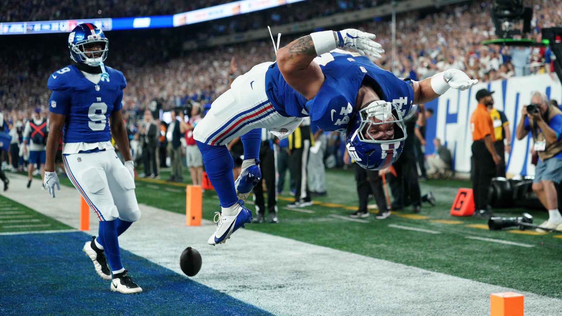 Giants' offense rolls over the Cowboys to give coach John Harbaugh a 28-20 win in his debut