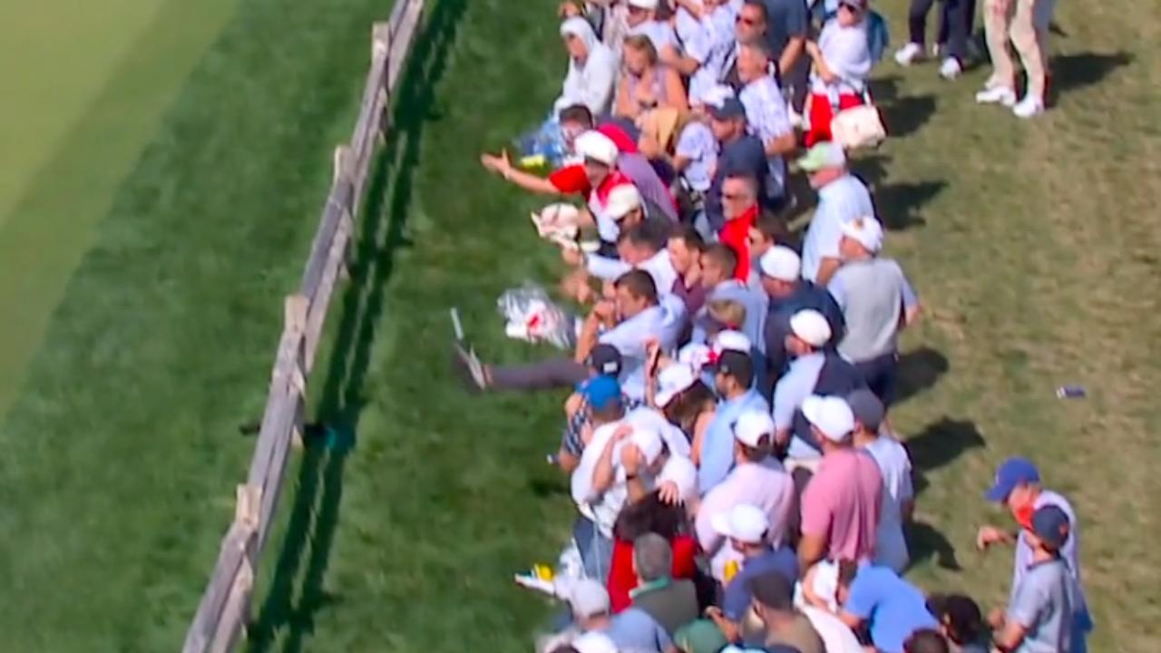 Fan kicks ball in effort to help Corey Conners' shot stay in bounds — Article image accompanying U.S., minus Scheffler in foursomes, down 3 at Presidents Cup on WagerUp Sports News. Fan kicks ball in effort to help Corey Conners' shot stay in bounds — Article image accompanying U.S., minus Scheffler in foursomes, down 3 at Presidents Cup on WagerUp Sports News.