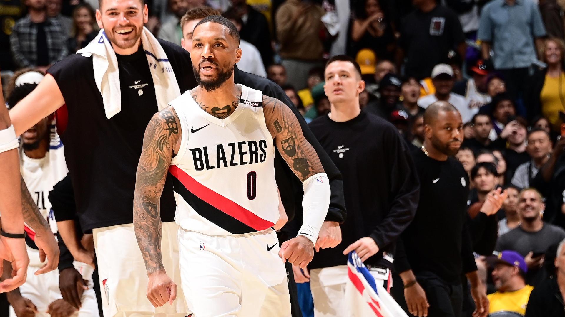 Ja Morant, Damian Lillard lead unbeaten Trail Blazers past Lakers 136-129 despite Luka Doncic's 41