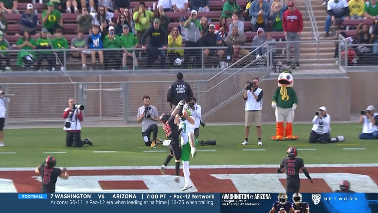 Terrance Ferguson goes over a defender for an Oregon TD