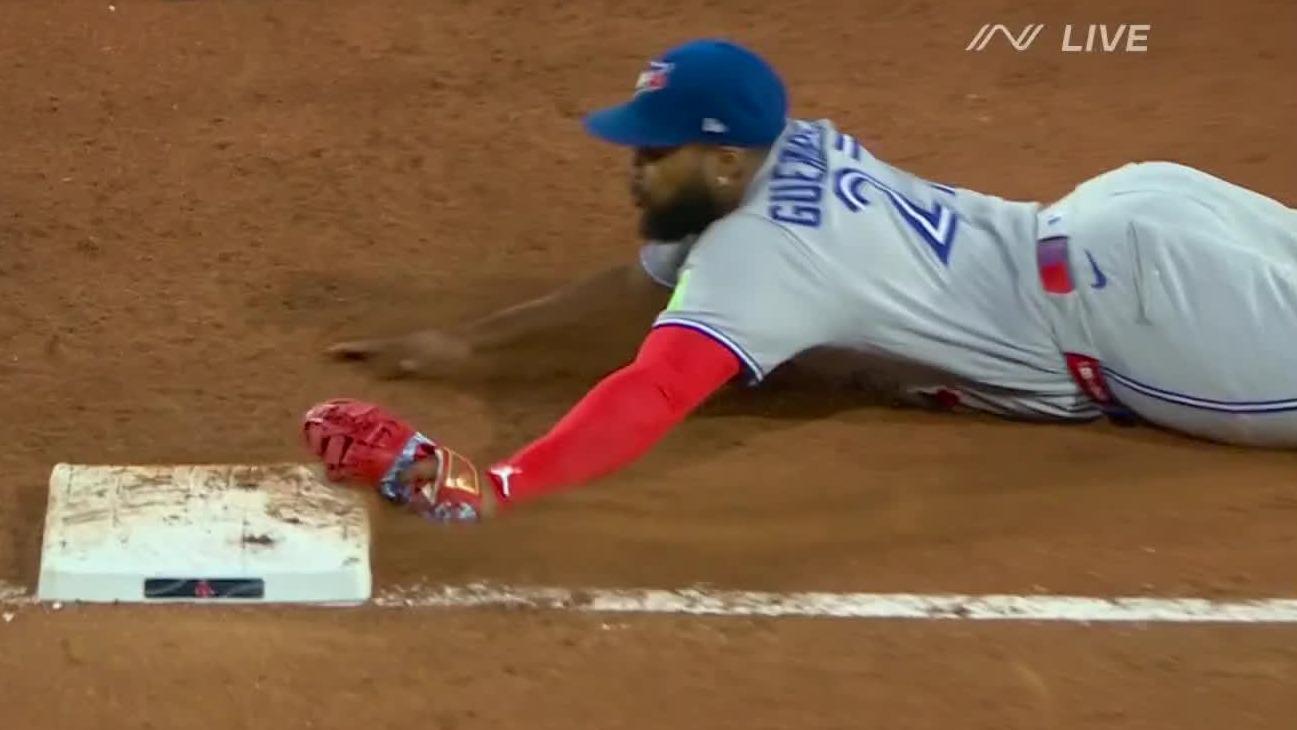Vladdy beats the runner to 1st with epic sliding play