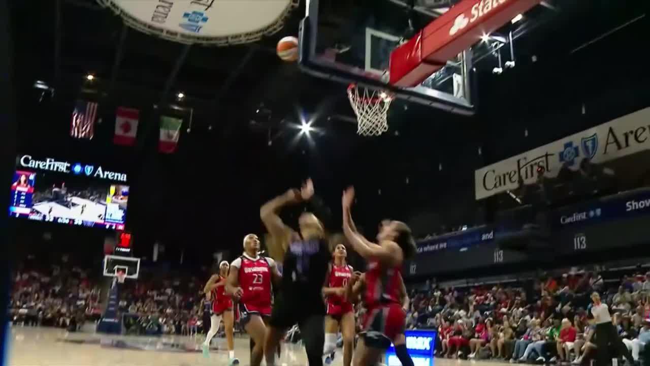 Veronica Burton somehow gets the and-1 to fall