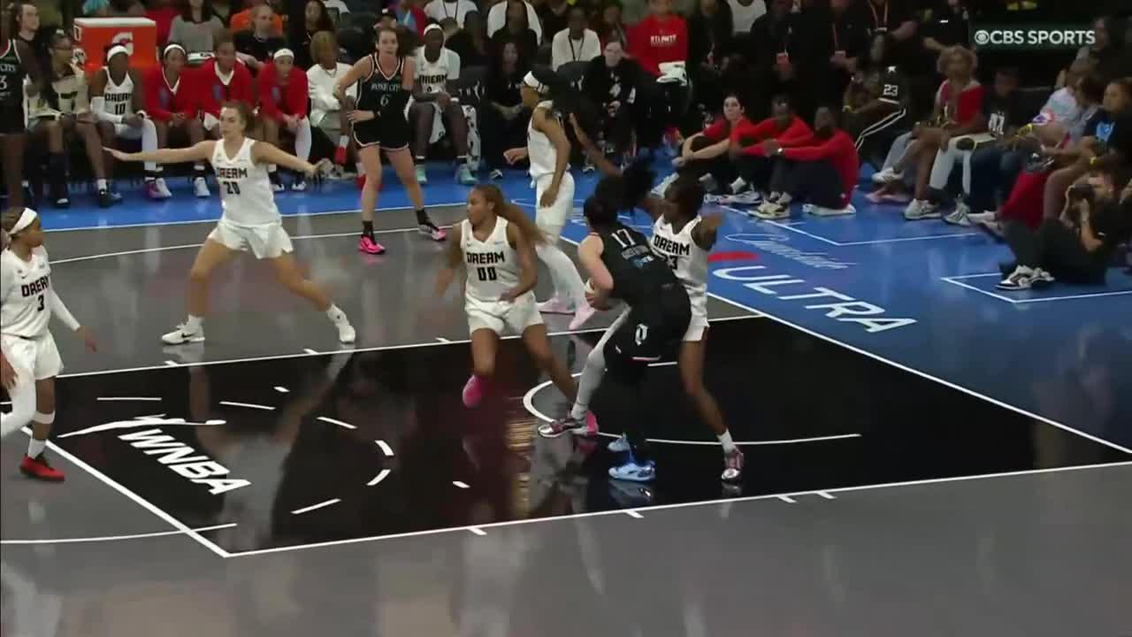 Megan Gustafson fights off defender for and-1