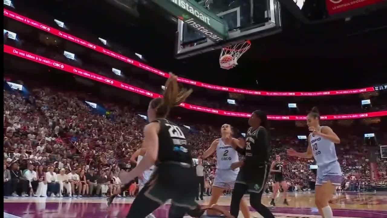 Sabrina Ionescu somehow gets the and-1 to fall