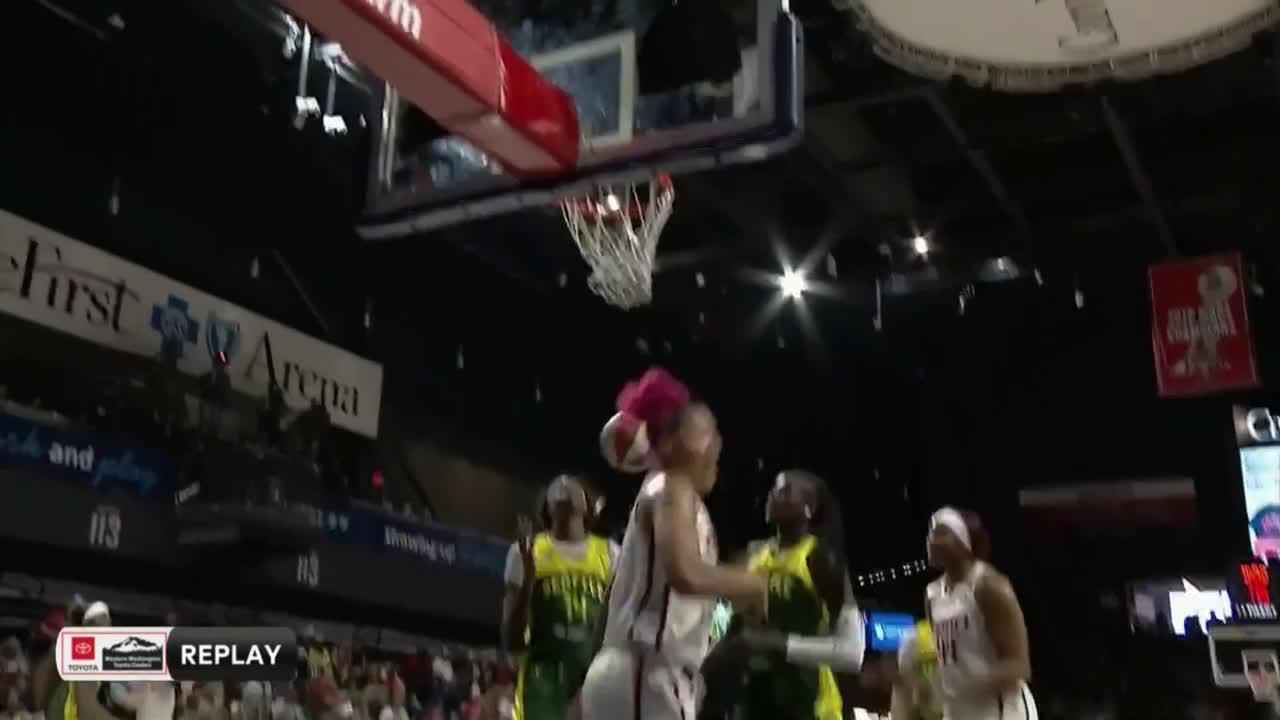 Shakira Austin gets the hoop and the harm