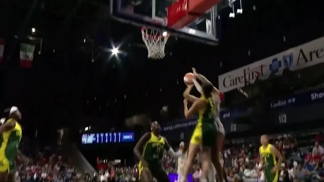Shakira Austin gets the and-1 to fall