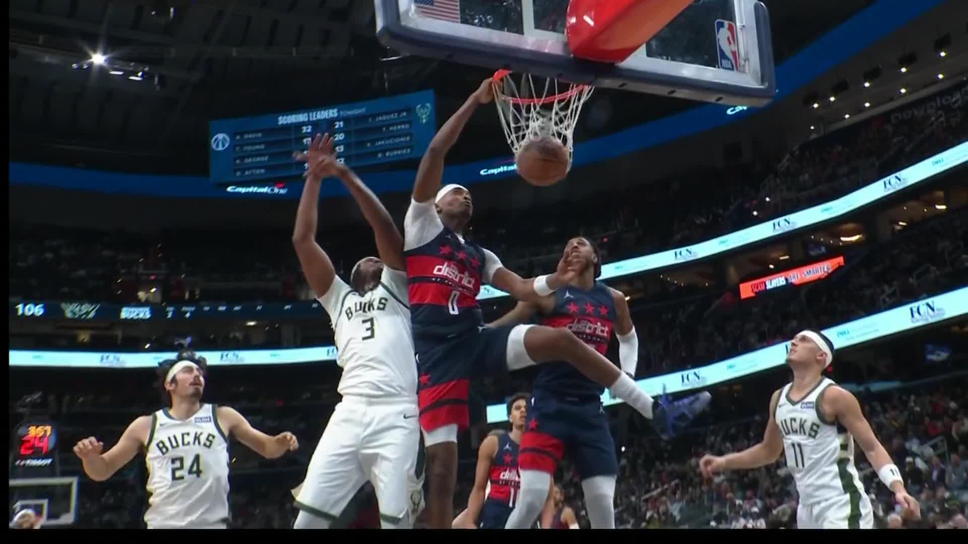 Davis scores 34 points in his Washington debut, leading the Wizards over Milwaukee 128-116