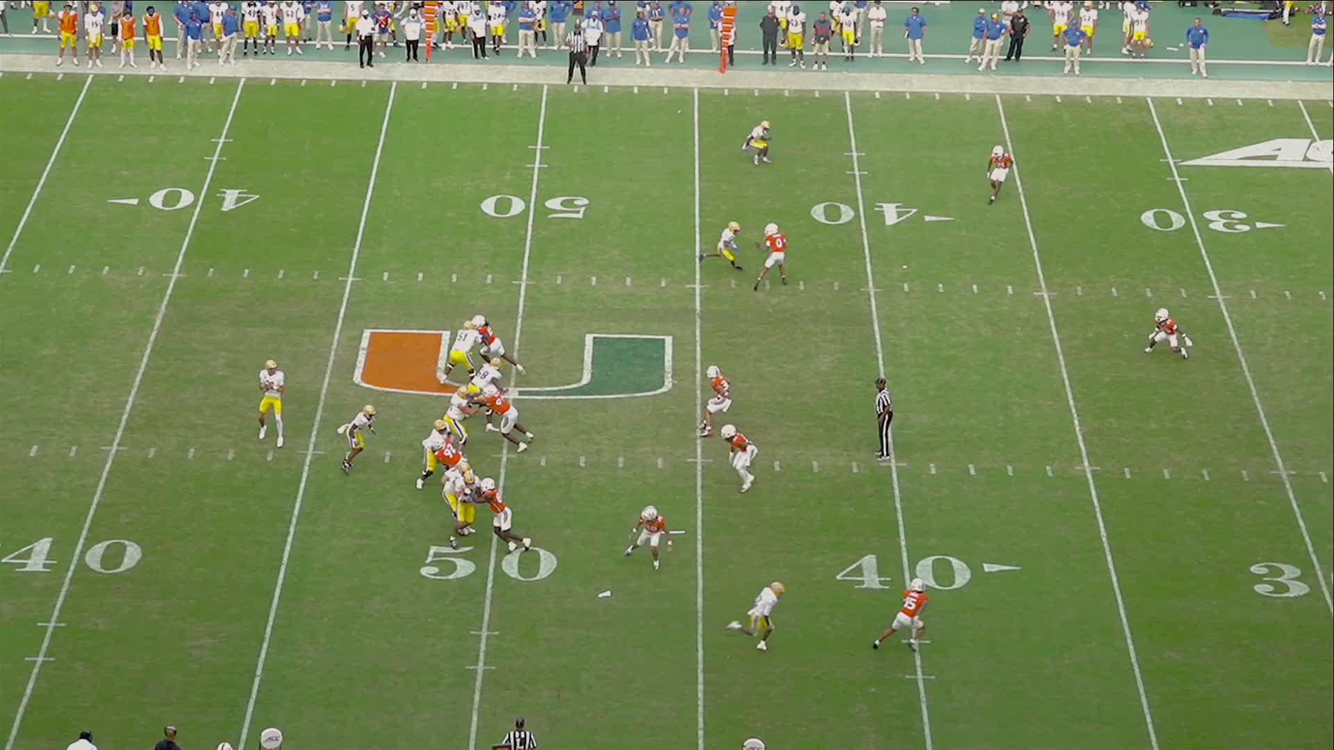 No. 1 Miami, in its first game atop AP poll since 2002 season, rolls past Pitt 52-23